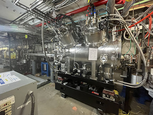 The assembled undulator was enclosed in this cryostat, which is shown installed on the APS storage ring. This device contains an electrical system to power the magnets as well as other components that run liquid helium through the magnets. The cryostat’s outer shell is a 2-meter-long vacuum vessel (photo by Argonne National Laboratory).