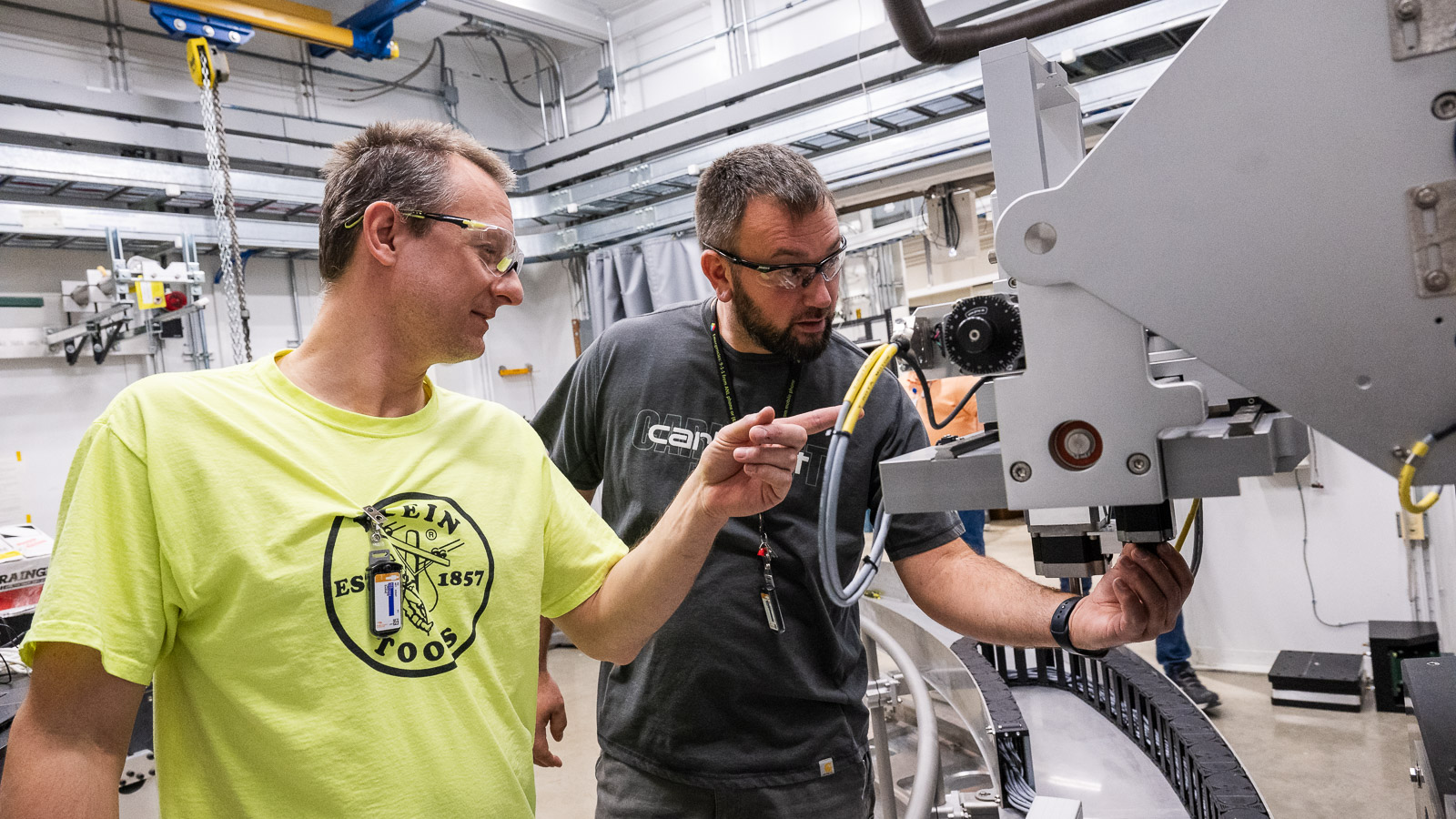 Two men working on a machine