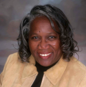 Headshot of woman smiling.