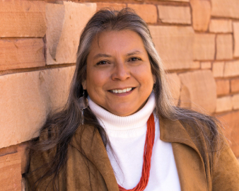 Headshot of woman smiling.