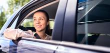 Young girl leaning out a car window.LabCab rideshare service available for employees, users, students and visitors